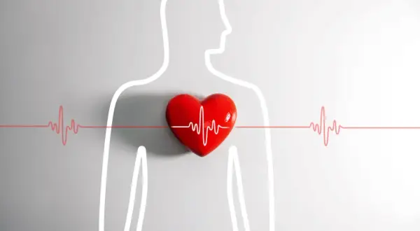 Czerwone serce z linią EKG symbolizuje kołatanie serca w nocy. Sylwetka człowieka podkreśla problem zdrowotny.